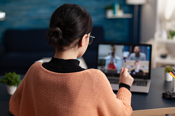 Woman watching webinar on laptop